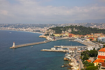 Fototapeta premium Beautiful view of Nice harbor from Mont Boron. Also you can see the Promenade des Anglais, the marina, buildings and the Mediterranean Sea, Nice, French Riviera, Provence, Côte d'Azur, France.