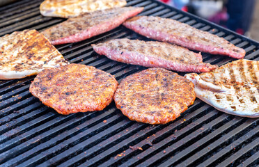 Appetizing pieces of grilled meat cooked on the grill