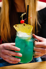 summer mocktail in the hands