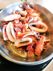 Fresh Grilled octopus served in vintage metallic pan for a mediterranean meal