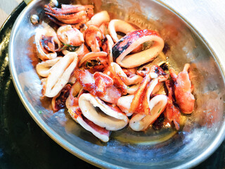 Fresh Grilled octopus served in vintage metallic pan for a mediterranean meal