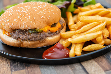 Cheese burger - American cheese burger with Golden French fries