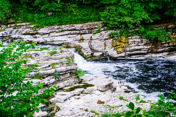 small waterfall in river Kent at force falls Sedwick