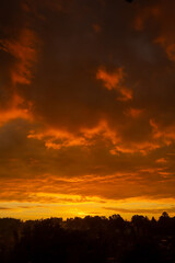 Fototapeta na wymiar Beautiful orange and yellow dusk after a rainy day.