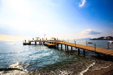 Obraz premium aerial shot,Beach and Fishing Pier at Sunset. Sunset over the Pier.