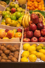 A counter with juicy and delicious fruits. With lots of wholesome food