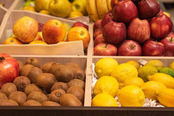 A counter with juicy and delicious fruits. With lots of wholesome food