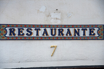 Ceramic Restaurante sign board in Granada, Andalucia, South of Spain