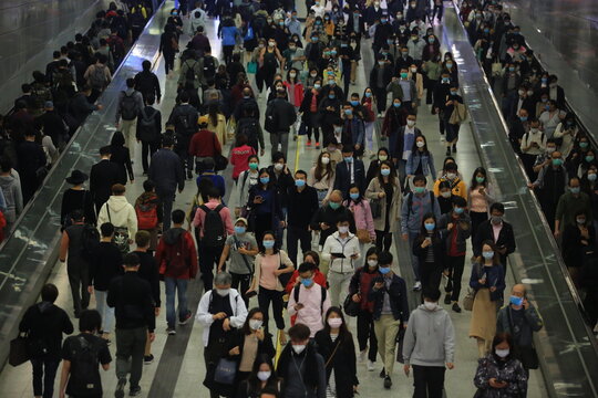 masked metro crowd in hong kong