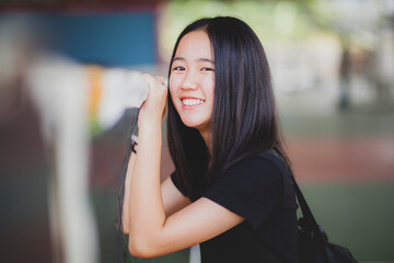 toothy smiling face of asian teenager happiness emotion