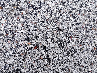 Sea pebbles texture. Multicolored small boulder and stone texture. Gravel pebble background. Small stones on the ground. Natural colorful gravel on summer beach.