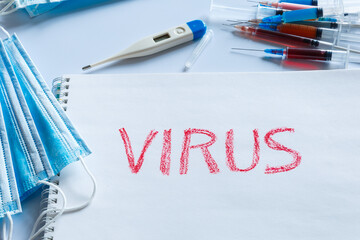 The inscription virus in red letters. The concept of viral diseases and prevention.