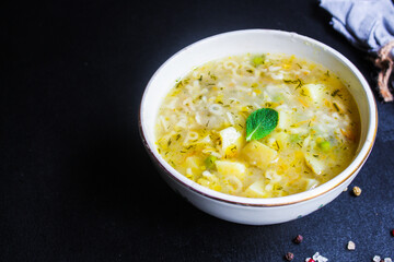 soup vegetables and pasta alphabet, peas, corn Menu concept healthy eating. food background top view copy space for text table setting keto or paleo diet