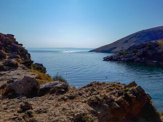 View from rocky coast and hills in Oprna bay beach, Stara Baska on Krk island , Croatia.