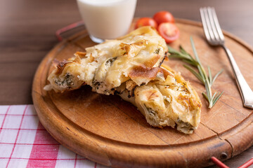 Traditional balkan breakfast - Burek pie with cheese and spinach