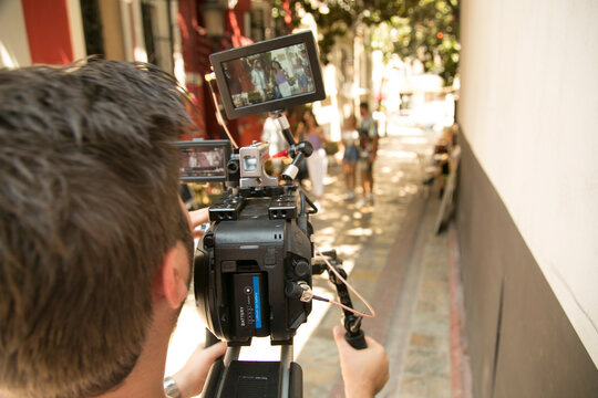 Behind the scene. Cameraman shooting the film scene with camera