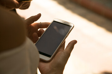 teenager friend group standing outdoor using their smart phone having fun together ,social media and technology internet with people concept background