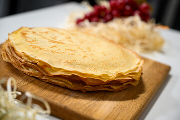 Pancakes with red caviar and sour cream, kitchen style