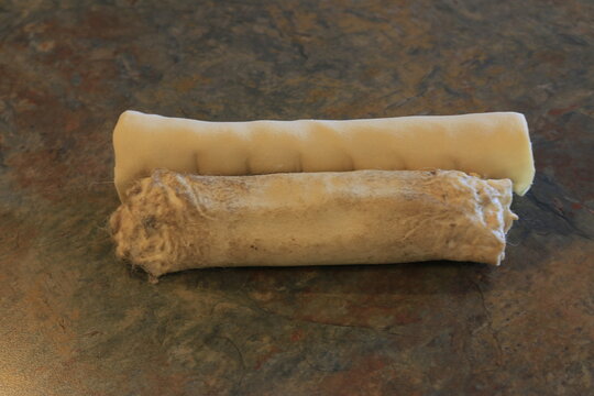 Rawhide Is Considered A Controversial Dog Chew Due To The Risk Of Dogs Choking. Photo Showing Partly Chewed Rawhide