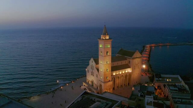 Aerial view, flight at dusk at the Cathedral of San Nicola Pellegrino, Sea Cathedral of Trani, Puglia, Southern Italy, Italy