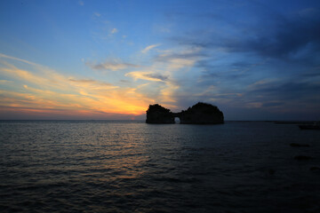Naklejka na ściany i meble beautiful sunset with sunlit of Engetsu Island in southern japan