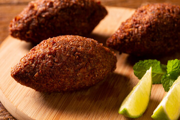 Kibbeh - Middle Eastern minced meat and bulghur wheat fried snack. Also popular party dish in...