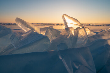Sunrise sky and ice on frozen Lake Baikal, winter season in Siberia, Russia