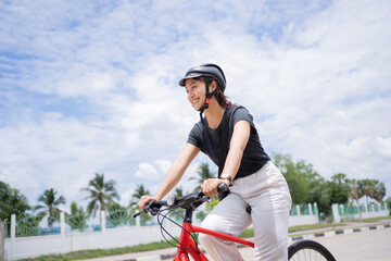 Asian university students riding bicycles