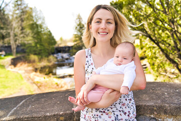 Fototapeta premium Beautiful Mother And Baby outdoors. Mum and her Child playing together