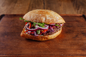 juicy Burger on wooden background