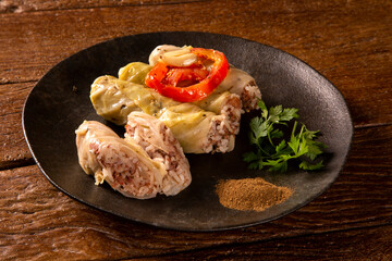 Arabic food. Appetizing cabbage rolls on wood background