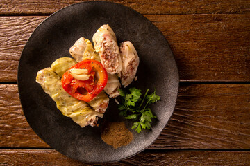 Arabic food. Appetizing cabbage rolls on wood background