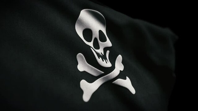 Embossed textured fabric pirate flag featuring the skull and cross bones or jolly roger blowing and waving in the wind in a full loop