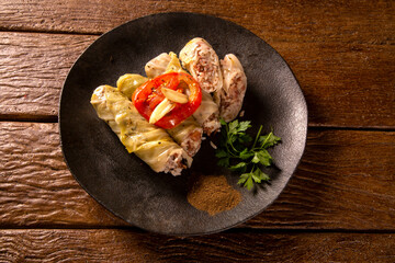 Arabic food. Appetizing cabbage rolls on wood background
