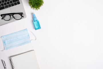 The equipment to protect COVID-19, blue mask and hand cleaner gel for preparing to work from home...