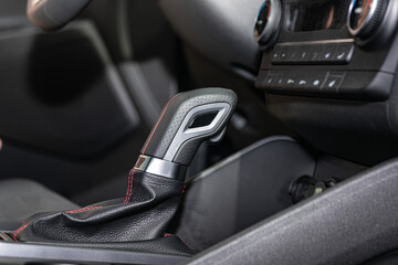 The interior of a modern car. Automatic transmission lever low angle.