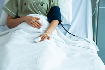 Close up hand asian woman patient. Focus on the hand of a patient in hospital ward