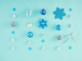 Christmas decorations on light blue background.