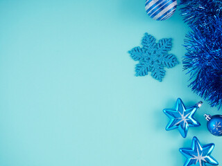 Fototapeta premium Christmas decorations on light blue background.