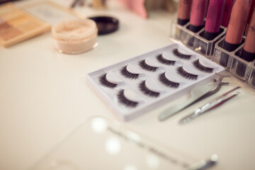 Different professional makeup products on table