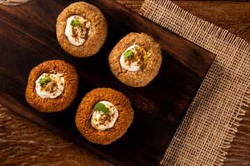 kibe stuffed with dry curd on wood background.