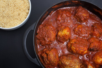 A Libyan dish called Mafrum, stuffed potatoes with minced beef and cooked in a tomato sauce and served with couscous