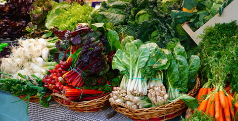 Vegetable stand at a marketplace. The Mercat de la Concepcio, market in Barcelona, Spain.     