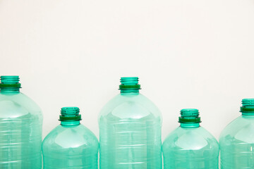 Empty used green plastic water bottles for recycling. environment concept