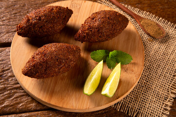 Kibbeh - Middle Eastern minced meat and bulghur wheat fried snack. Also popular party dish in Brazil (kibe).