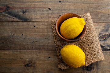 lemon on wood background, organic food
