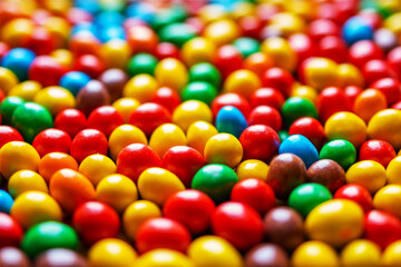 Fototapeta na wymiar Image of colored round sweets. Background of small multicolored dragees. Closeup. Side vew.