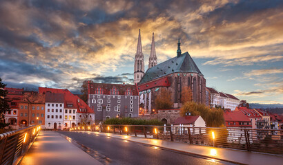 Fantastic colorful sky under sunlit during sunset, over the Church of St. Peter and Paul in...