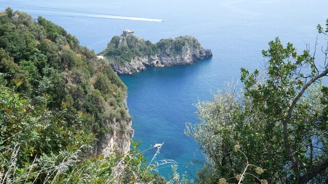 Promontory and tower of Capo di Conca in the municipality of Conca dei Marini. Coastal tower on the mediterranean sea. Amalfi Coast, Salerno, Campania, Italy