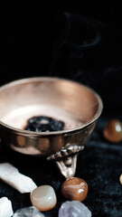 Incense in a bowl on the background.